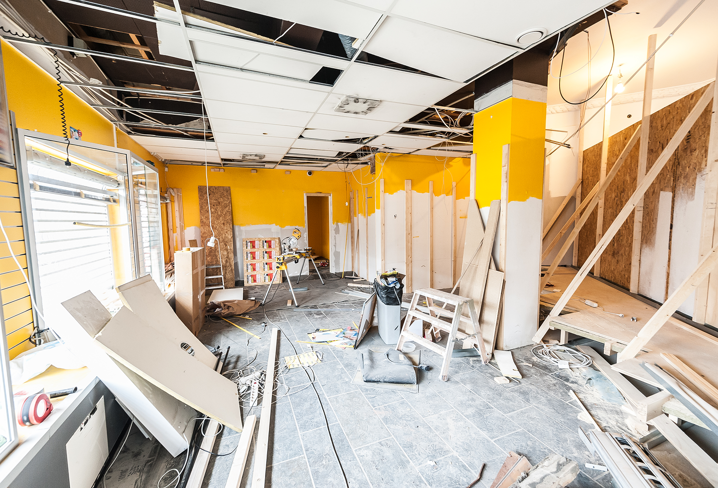 Room under construction with scattered materials.